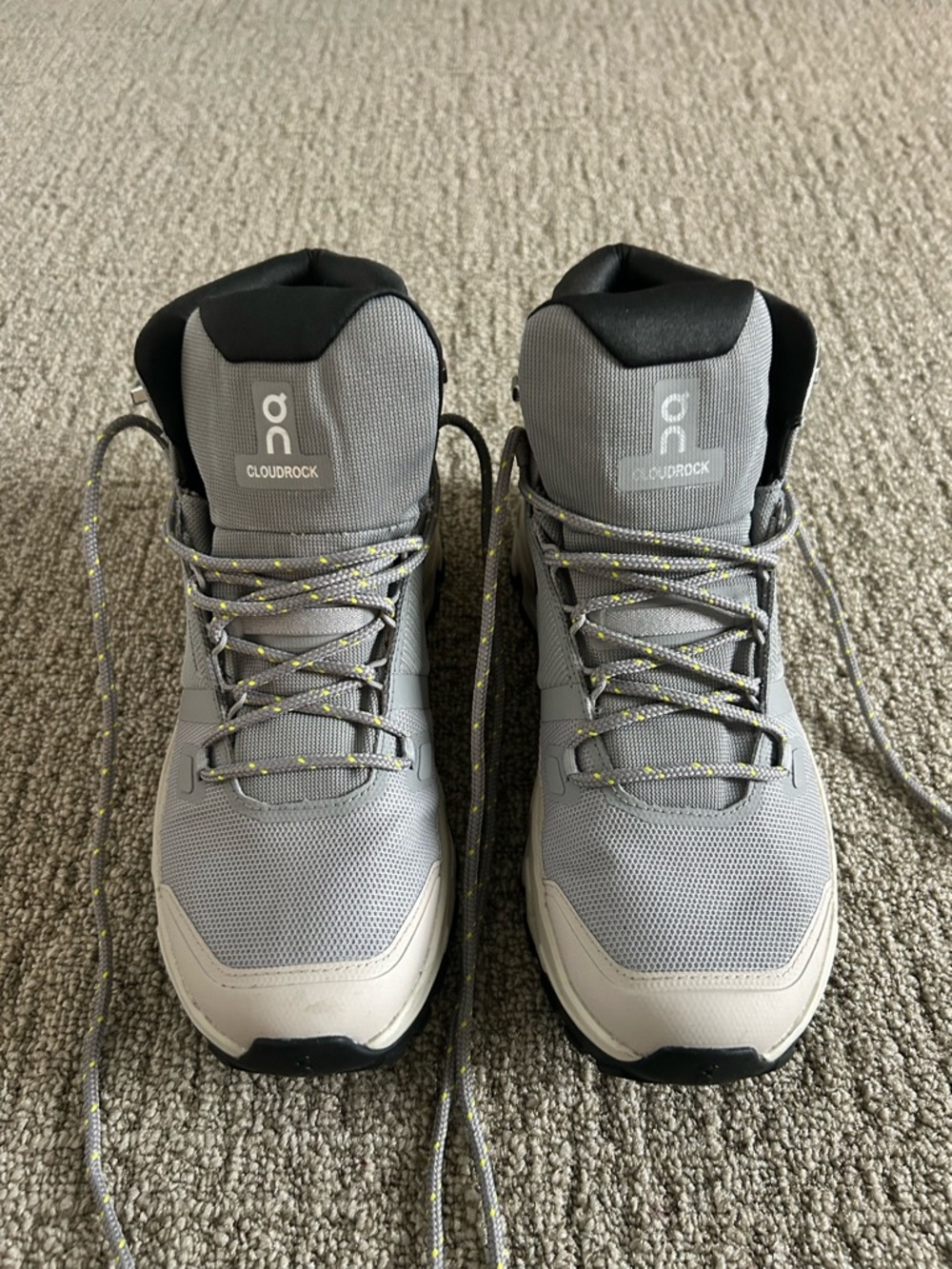 On Running Cloudrock womens Gray and Black Hiking Boots with Yellow-Accent Laces